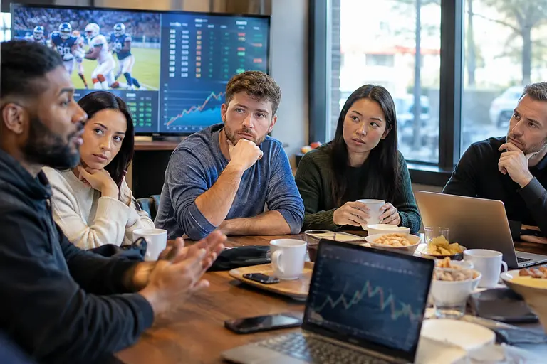 Trading desk with betting market dashboards and pricing models